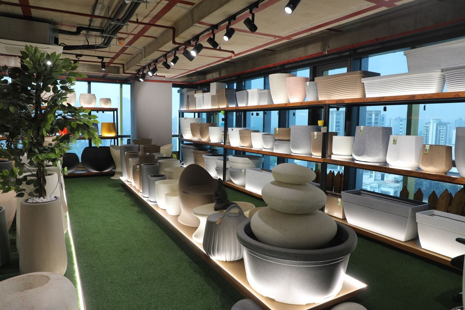 Explore a contemporary showroom featuring stylish pots and planters. Perfect for interior design inspiration.