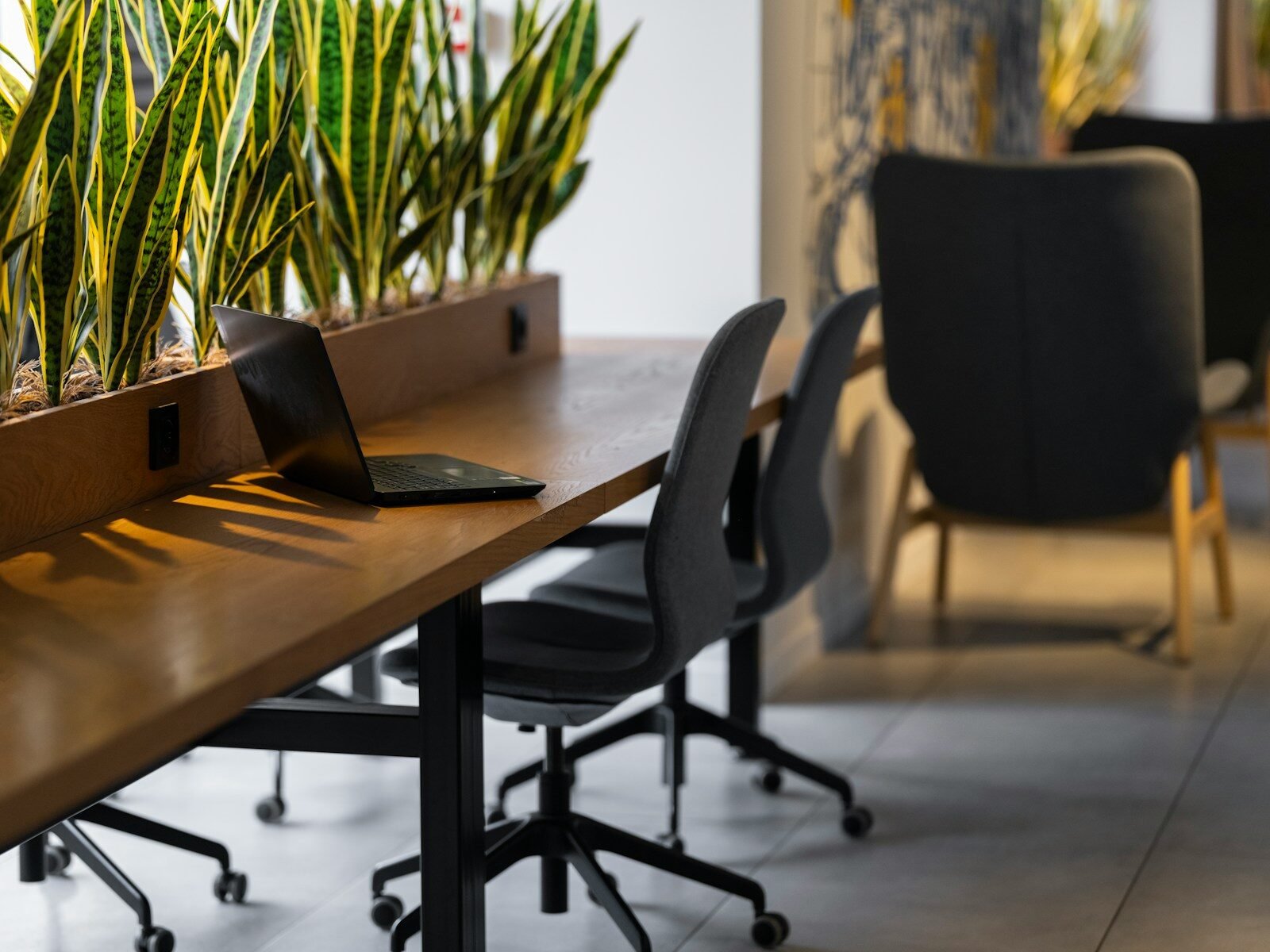 a long table with a laptop on top of it